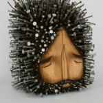 Stunning figurative wood sculptures pierced with hundreds of nails by Jaime Molina