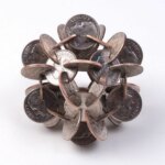 Geometric sculptures made from old coins by Robert Wechsler