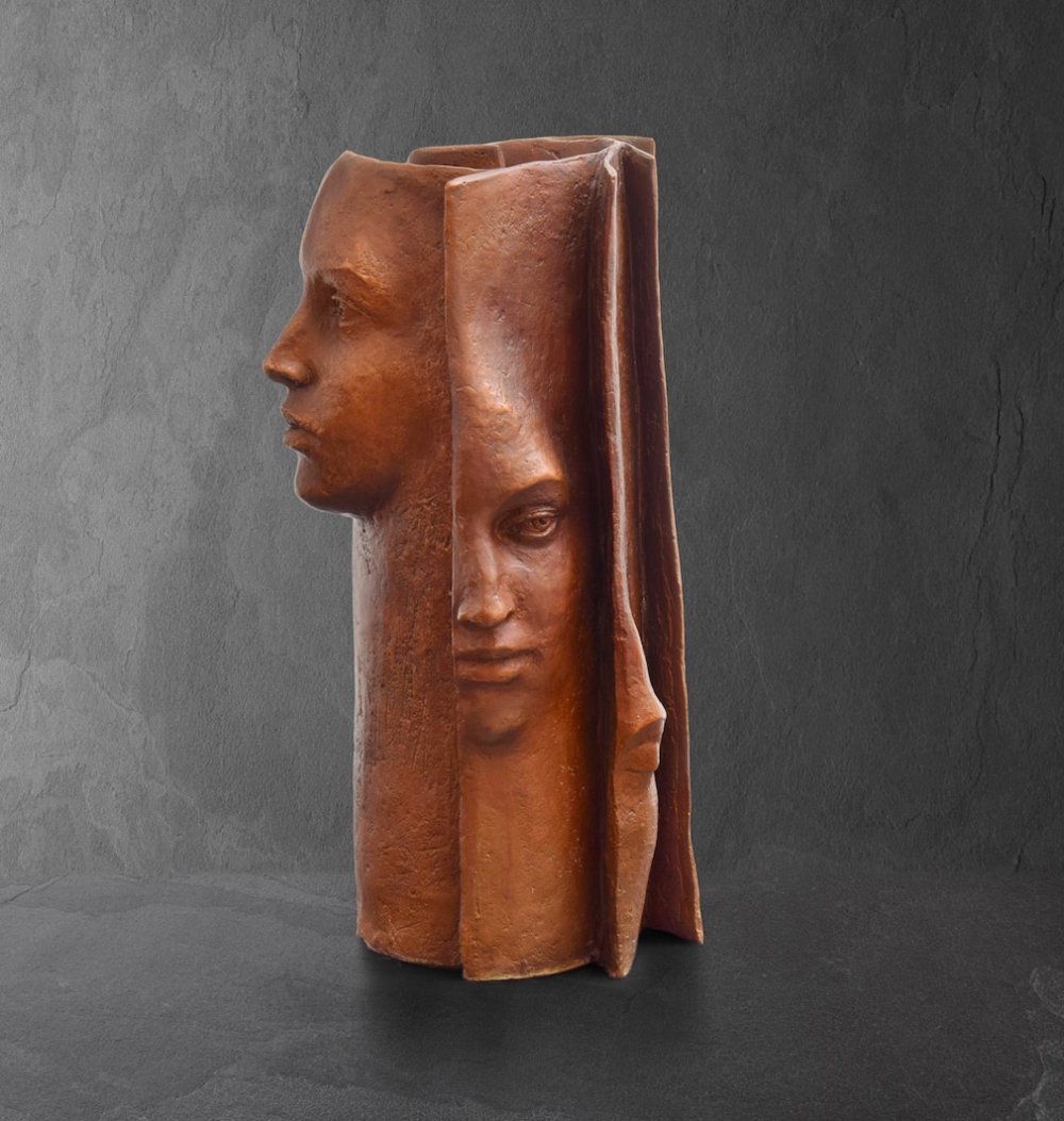 Stunningly Surreal Sculptures Of Human Faces Emerging From Book Pages By Paola Grizi 11