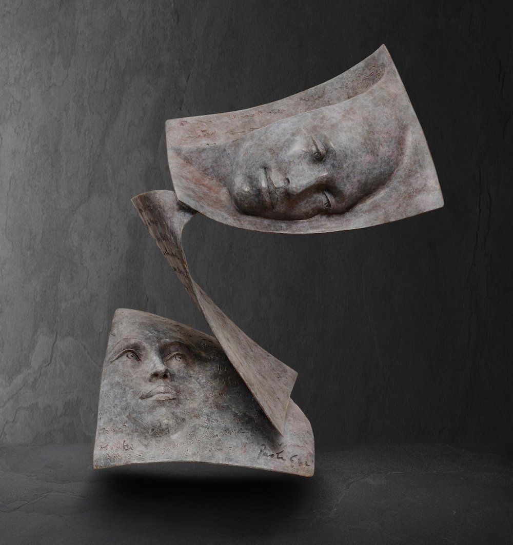 Stunningly Surreal Sculptures Of Human Faces Emerging From Book Pages By Paola Grizi 12