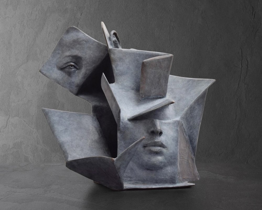 Stunningly Surreal Sculptures Of Human Faces Emerging From Book Pages By Paola Grizi 5