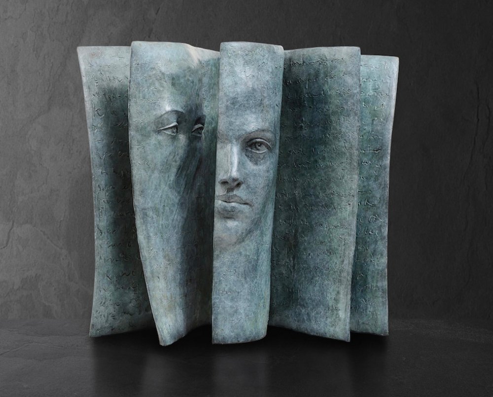 Stunningly Surreal Sculptures Of Human Faces Emerging From Book Pages By Paola Grizi 7
