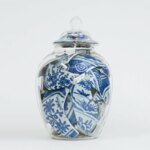 Still together: clever sculptures of broken porcelain vases within other glass ones by Bouke de Vries