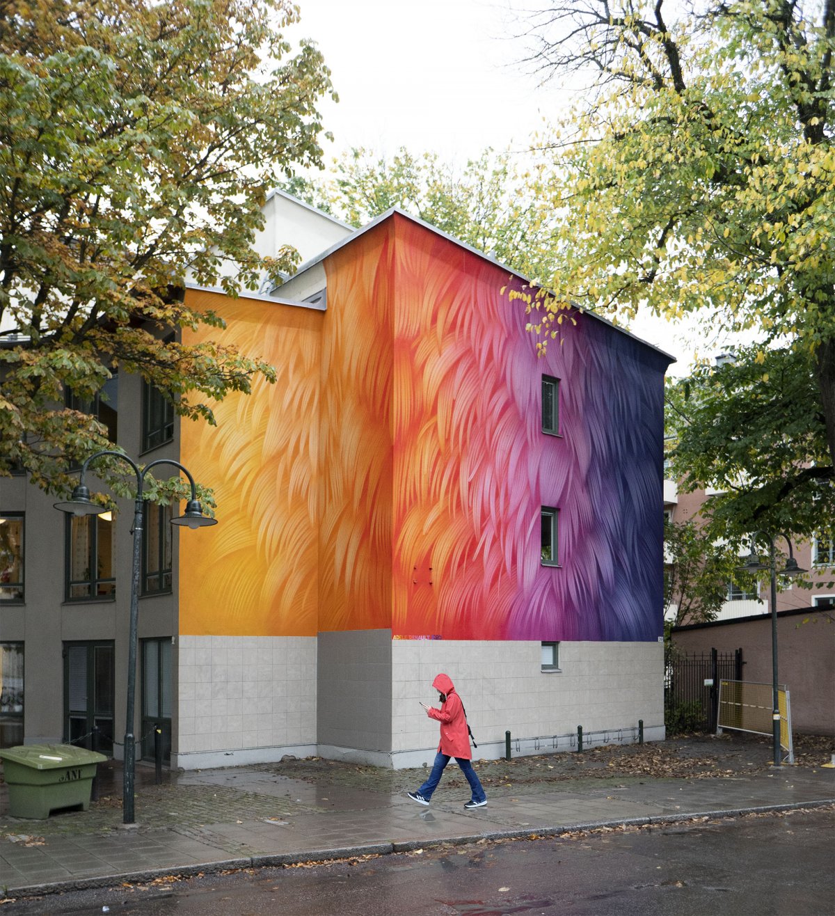 Vibrant murals of colored feathers by Adele Renault