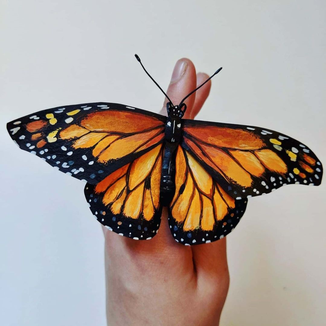 Intricate paper sculptures of butterflies and beetles By Kerilynn Wilson