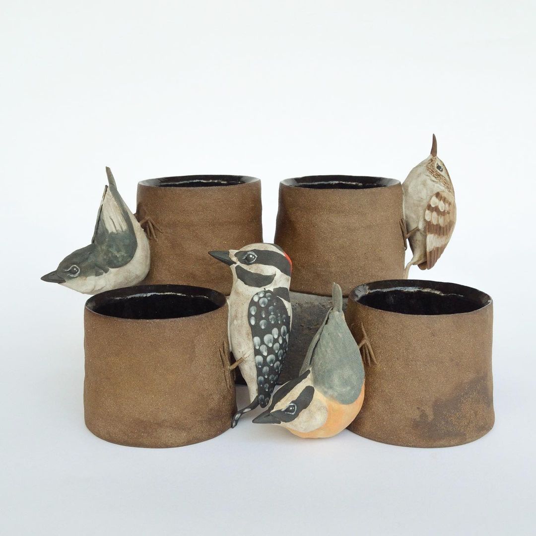 Ceramic vases ornate with realistic bird sculptures by Sarah Conti