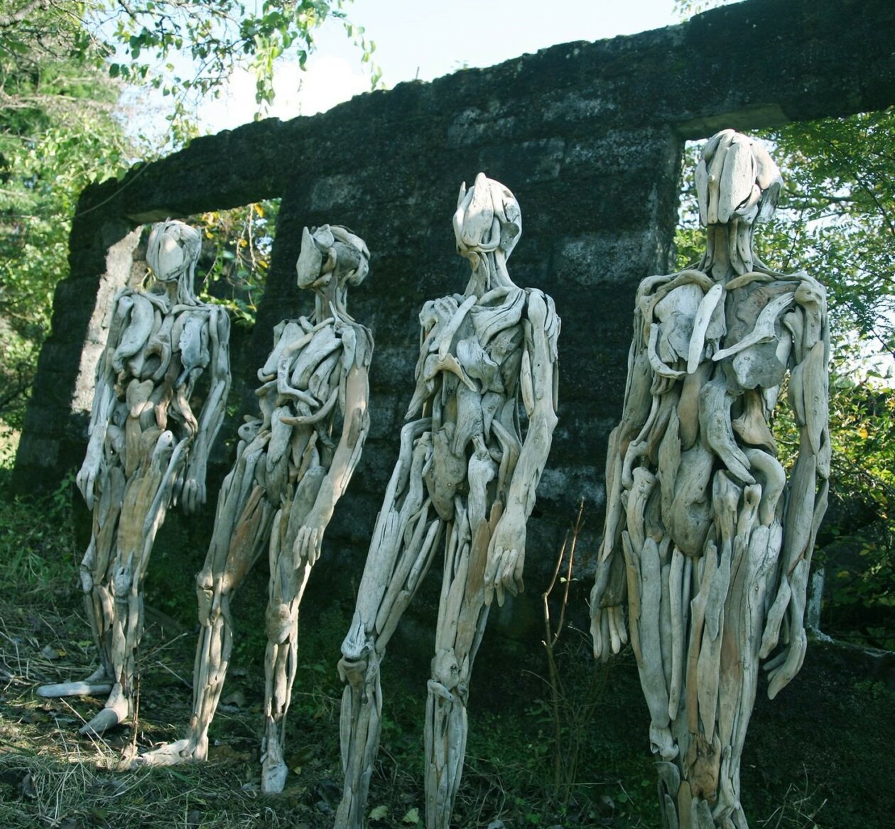 Eerie human-like driftwood sculptures by Nagato Iwasaki