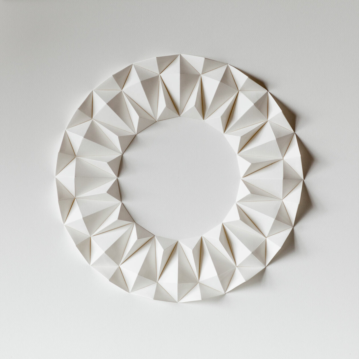 Origami-inspired geometric paper sculptures by Anna Kruhelska