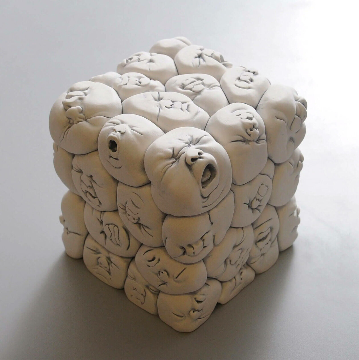 Distorted Baby Faces, Surreal Ceramic Sculptures By Johnson Tsang (22)