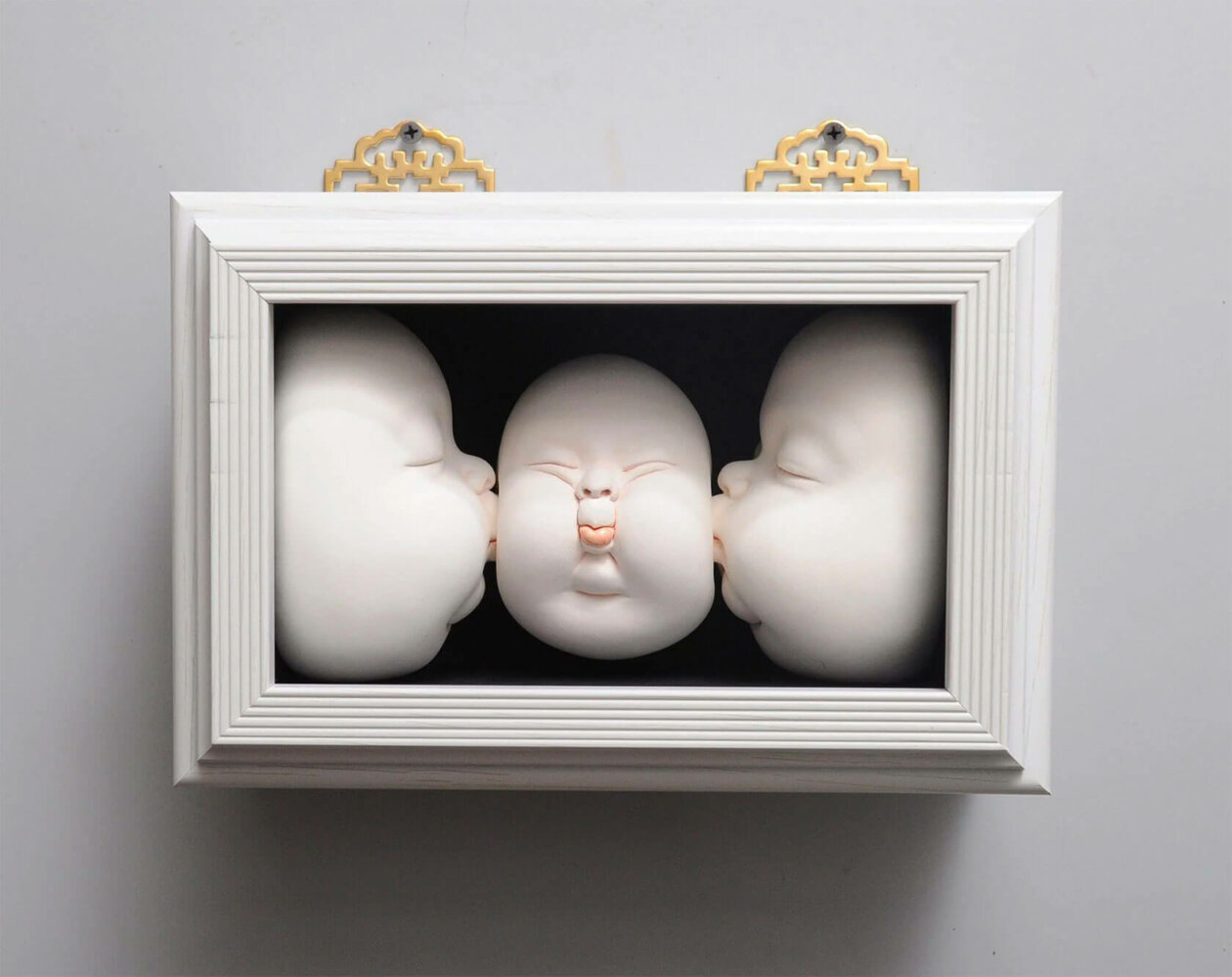 Distorted Baby Faces, Surreal Ceramic Sculptures By Johnson Tsang (28)